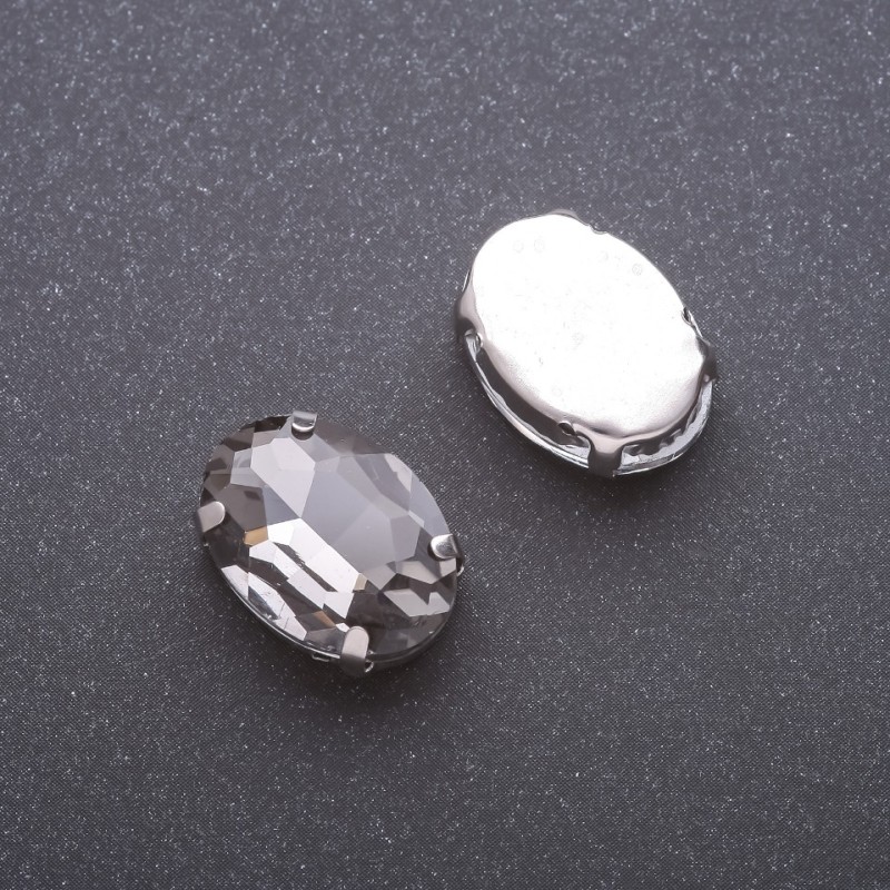 Price per pack of 10 pcs. Sew-on crystal in claw setting, oval 13x18mm, grey