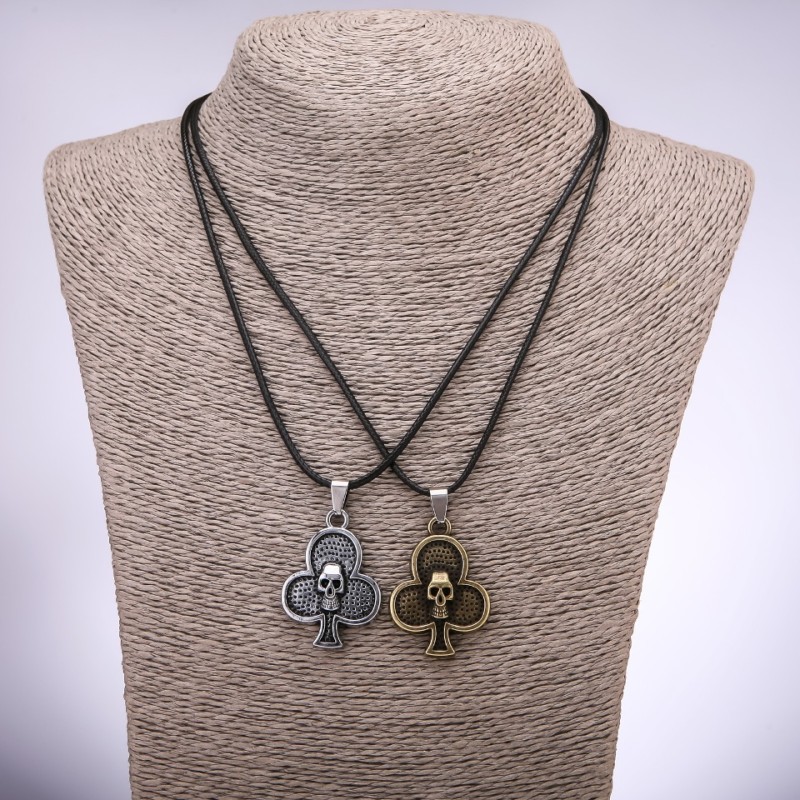 Pair of friendship pendants: Clubs with skulls, length 42-48cm, pendant 25x35mm