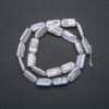 Natural Baroque Pearl Strand, diameter 18x10mm, length 39cm + - with a petrol sheen