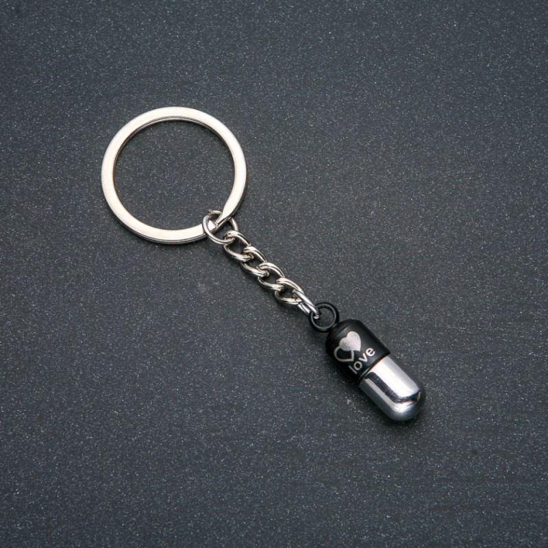 Keyring "Capsule of Love", diameter 30x9mm, length 8cm +/- silver-tone metal