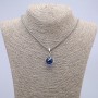 Pendant "Sphere in a Paw" 35x17mm on a chain, length 70cm +/- silver-coloured metal