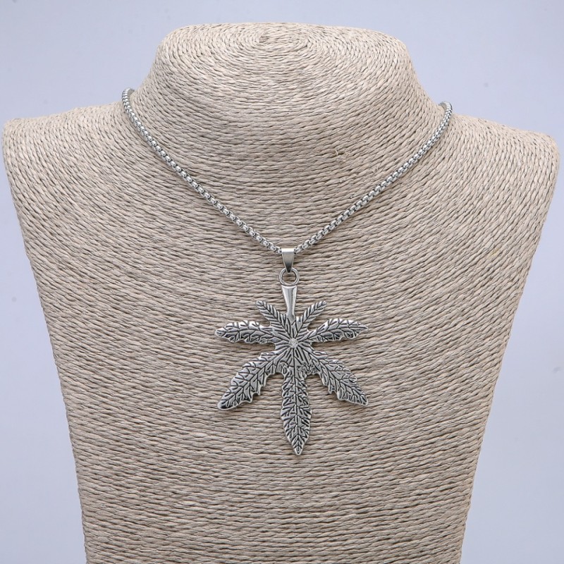 Pendant "Hemp Leaf" with White Rhinestone 72x53mm on a chain, length 65cm silver-coloured metal