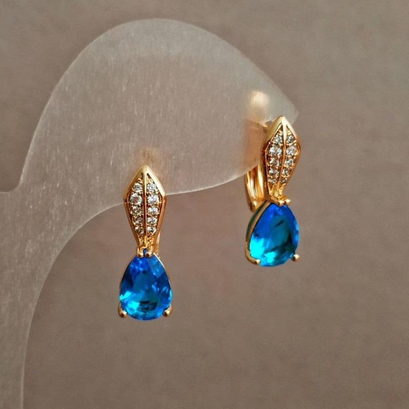 Xuping Earrings 18K Gold Plated with White Rhinestones and a Light Blue Crystal, diameter 20x6mm +