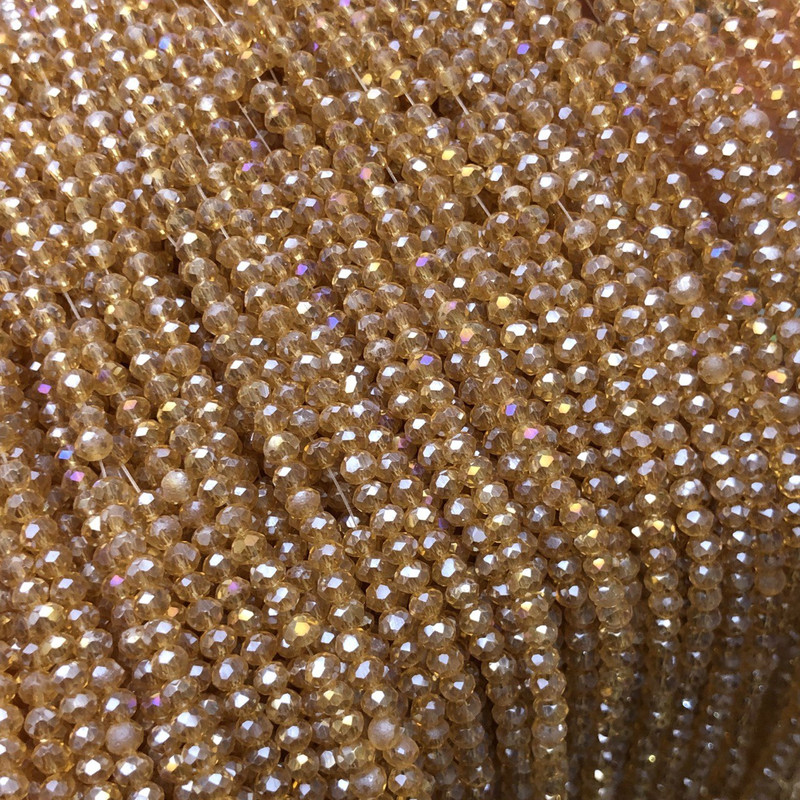 Czech Crystal Beads on fishing line, transparent orange-peach with petrol coating, faceted rondelle, diameter 3x2.5mm +/-, length 36cm +