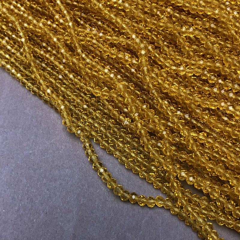 Czech Crystal Beads on fishing line, light yellow honey transparent, faceted rondelle, diameter 3.5x3mm +/-, length 36-38cm +