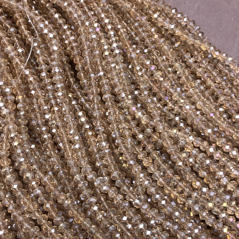 Czech Crystal Beads on fishing line, champagne transparent with petrol-tone shimmer, faceted rondelle, diameter 3.5x3mm +/-, length 36-38cm +