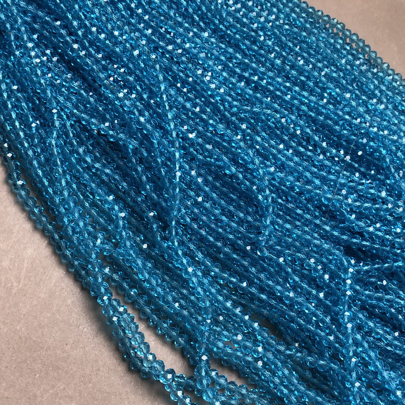 Czech Crystal Beads on fishing line blue-green transparent faceted rondelle, diameter 3.5x3mm +/-, length 36-38cm+