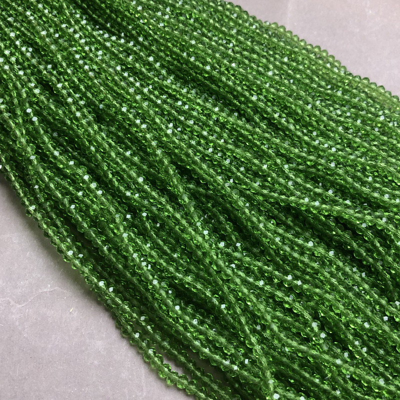Czech Crystal Beads on fishing line light green transparent faceted rondelle, diameter 3.5x3mm +/-, length 36-38cm+