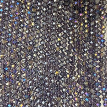 Czech Crystal Beads on a strand, purple transparent with petrol-tone iridescent coating, faceted rondelle, diameter 8x6.5mm +/-, length 40-42cm