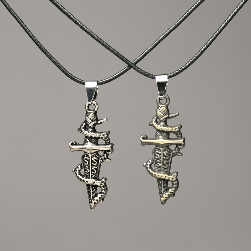 Matching Dagger Pendants on Cord 47x16mm + -, length 45-50cm