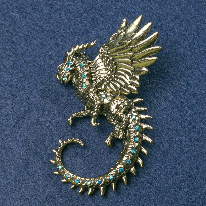 Brooch Dragon with golden metal and blue rhinestones 64x50mm+