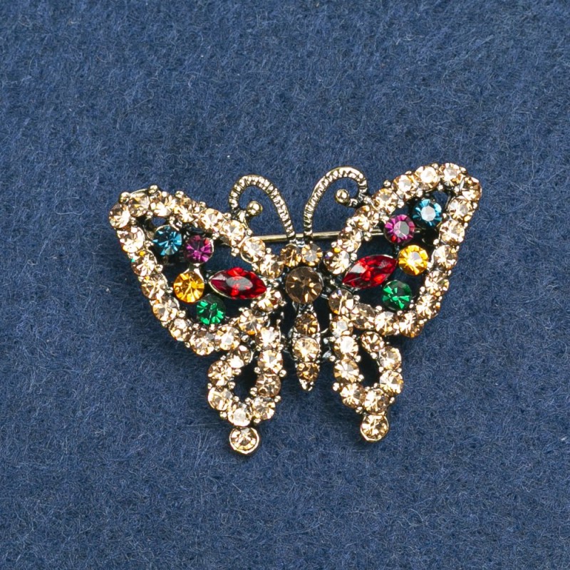 Brooch Butterfly with golden metal and rhinestones 36x28mm +