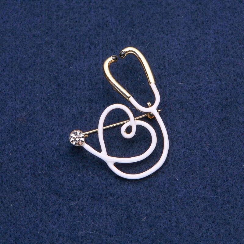White Stethoscope with Heart Brooch, white stone, golden metal 43×33mm