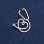 White Stethoscope with Heart Brooch, white stone, golden metal 43×33mm