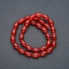 Carved barrel beads of Carnelian on thread, diameter 8×12mm, length 38cm