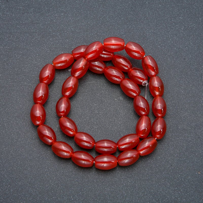 Carved barrel beads of Carnelian on thread, diameter 8×12mm, length 38cm