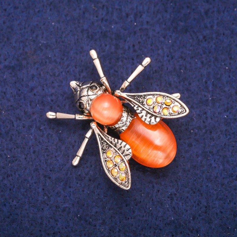 Brooch Butterfly with orange Cat's Eye and crystals, metal with golden sheen