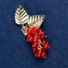 Brooch with Carnelian "Branch with Berries", gold-tone metal 60x35mm