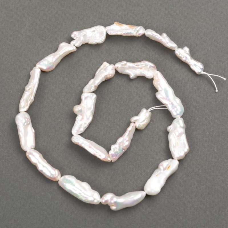 Baroque pearls with petrol tint on thread d 7-9×10–23 mm +-, length 38 cm+