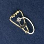 Stethoscope Brooch, white and black enamel, with white stone, gold-tone metal 43x24mm