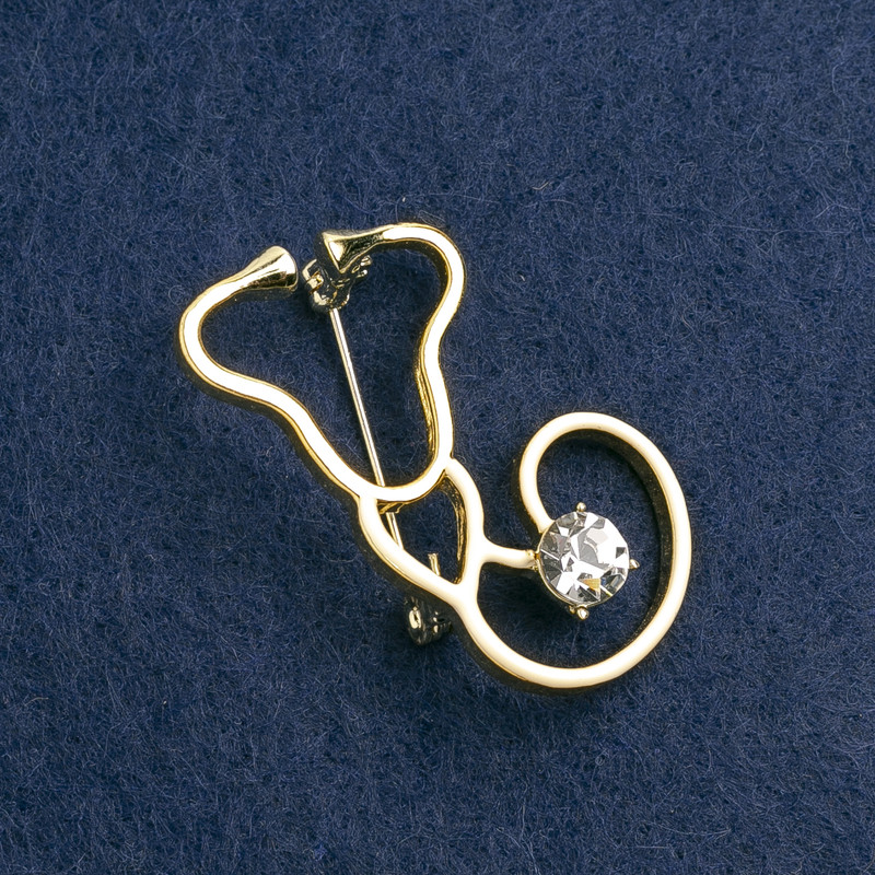 Stethoscope Brooch, white enamel, with white stone, gold-tone metal 42x25mm
