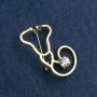 Stethoscope Brooch, white enamel, with white stone, gold-tone metal 42x25mm