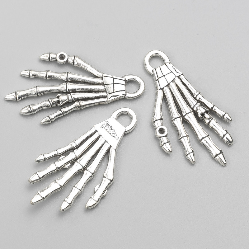 Pendant Finding Skeleton Hand 35x18 mm, pack of ~9 pcs, 20g