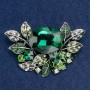 Brooch large Accent in a botanical design with rhinestones and green and white stone, silver-toned metal, 67x46mm