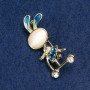 Brooch Bunny on a Scooter with white rhinestones, gold-coloured metal, blue enamel, Cat's Eye cabochon (white) 43x21mm +