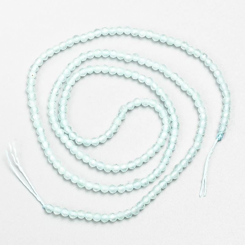 Small beads spinel (synth.) light azure faceted ball, diameter 2mm+/- on a thread, length 37cm