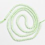 Small beads spinel (synth.) pale green faceted ball, diameter 2mm+/- on a thread, length 37cm