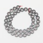 Hematite Round Beads, diameter 10x3mm+-, inner diameter 6mm, length 40cm+- on thread