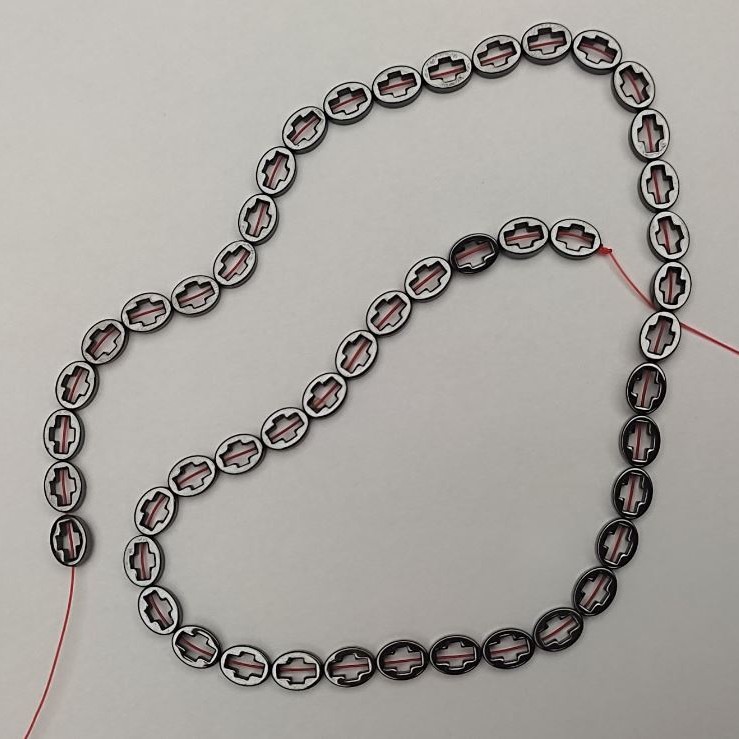 Hematite Beads Cross 6x8mm on thread, 39cm length +/-