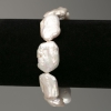 Bracelet of Baroque Pearls in the petrol hue, diameter 14x23mm ±, length 18cm ± (stretch)