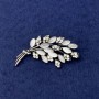 Twig Brooch with white cat's eye, white rhinestones, silver-tone metal, diameter 50x27mm+
