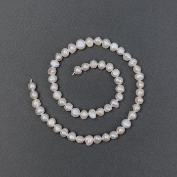 Freshwater pearls with a petrol hue on a thread, diameter 6.5×4.5–6 mm, length 36 cm
