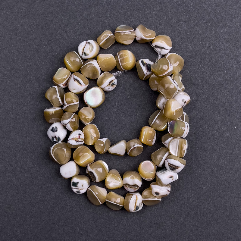 Beads - tinted mother-of-pearl beige faceted, diameter 8x6mm±, length 41cm± on thread