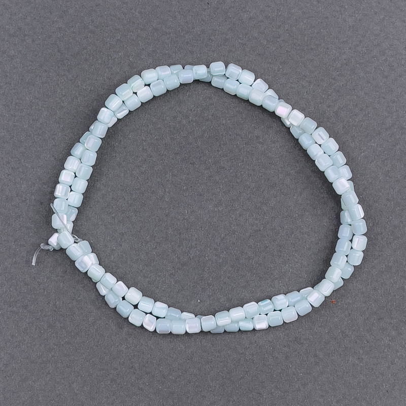 Turquoise-toned Mother-of-Pele Pearl Cylinder Beads, diameter 3.5mm, length 40cm on thread (approx)