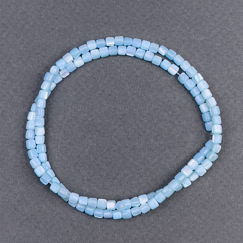 Toned blue mother-of-pearl cylindrical beads, diameter 3.5x3.5mm, 40cm long on beading thread