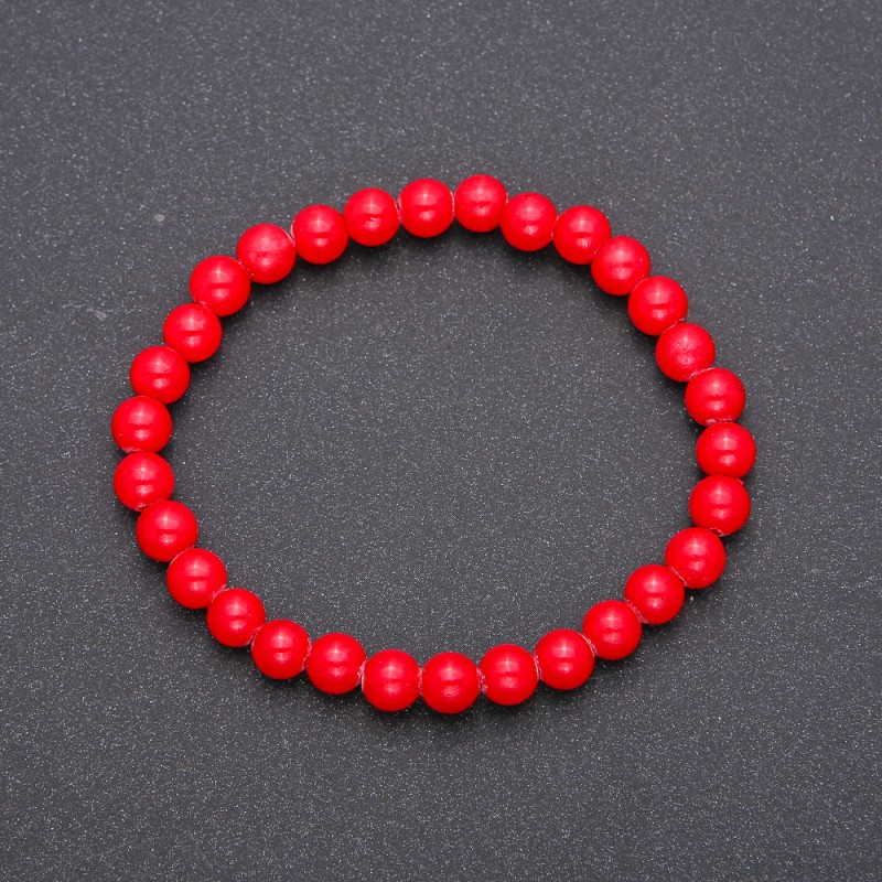 Bracelet of natural coral beads on elastic with smooth round beads, diameter 6(±)mm, length 18cm