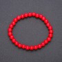 Bracelet of natural coral beads on elastic with smooth round beads, diameter 6(±)mm, length 18cm