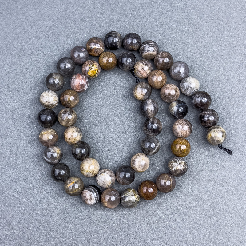Sunstone Beads natural smooth ball diameter 8.5 mm ± on thread, length 39 cm+