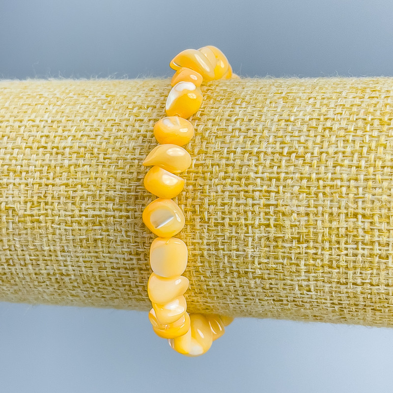 Bracelet, Light Orange Pearlized Shell, faceted beads, 8x6mm, stretchy, 18cm
