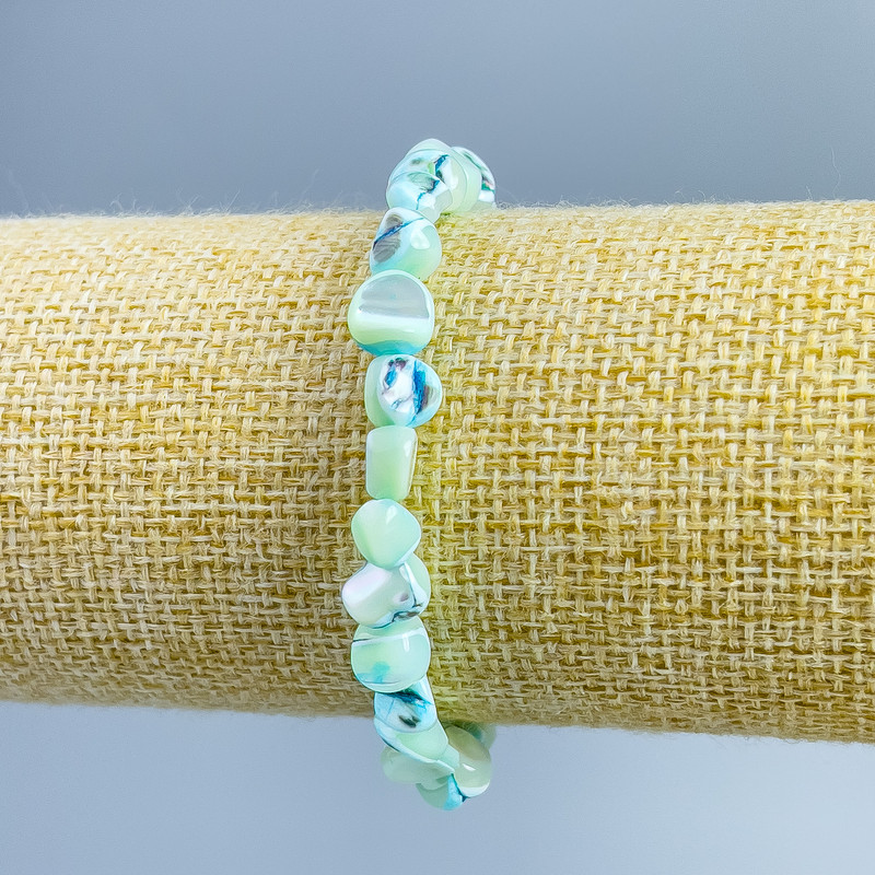 Bracelet Pearlized light blue faceted beads, diameter 8×6mm±, length 18cm (stretch)