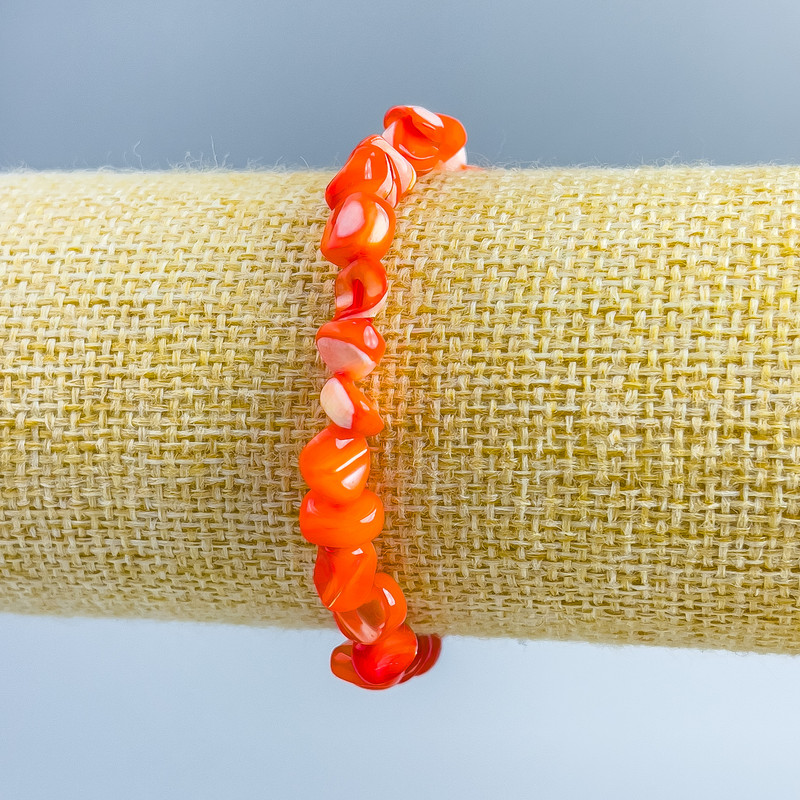 Bracelet Mother-of-Pearl Orange faceted beads, diameter 8x6mm+-, length 18cm (stretch)