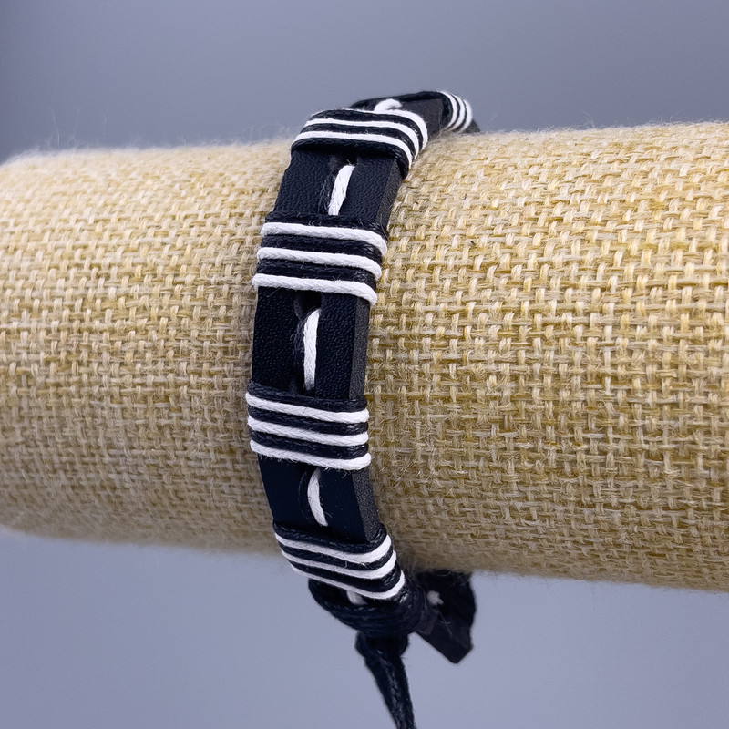 Bracelet, length 18-25cm, thickness 14mm black and white eco-leather with adjustable slide closure